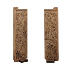 pair of carved wooden bookends on stands