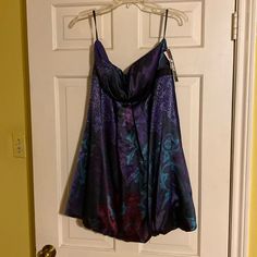 Never Worn! Original Tags Still On. Satiny Feel, Empires Waist. Beautiful Jewel Tone Blacks, Aquas, Purples, And Burgundy. Size 13-14. Ptp - 18” Length - 29” Original Price $119 Purple Sleeveless Mini Dress For Prom, Purple Strapless Dress With Sweetheart Neckline For Evening, Purple Strapless Dress With Sweetheart Neckline, Elegant Multicolor Strapless Evening Dress, Dressy Purple Sleeveless Dress, Elegant Purple Strapless Dress For Date Night, Purple Sleeveless Mini Dress For Evening, Purple Strapless Dress For Spring Prom, Purple Mini Length Evening Dress