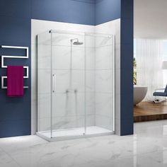 a bathroom with blue walls and white tile flooring, including a walk in shower