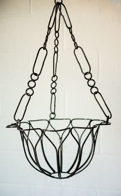 a metal basket hanging from the ceiling