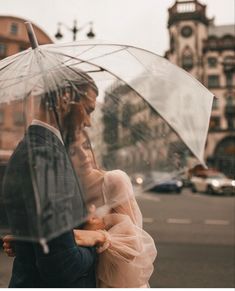 a man and woman standing under an umbrella