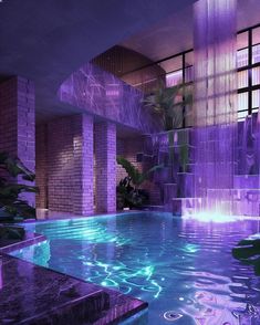 an indoor swimming pool with purple lighting and plants in the water, surrounded by tall brick pillars