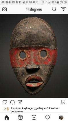 an old mask with red and black paint on it's face is shown in the instagram