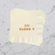 two napkins with the words on cloud 9 printed on them