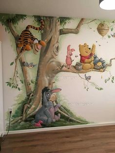 winnie the pooh mural in a children's room