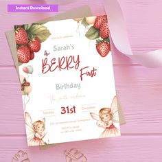 a birthday card with an image of strawberrys and fairy on it, next to some scissors