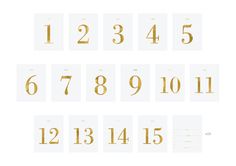 gold numbers and numerals are arranged in the form of squares on a white background