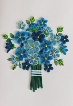 a bouquet of blue flowers made out of paper