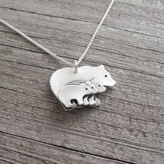 "8/4/2022 SHOP UPDATE: My production time is now 2-3 weeks. My Mother and Three Baby Bears Necklace is handcrafted in fine silver. I create the mom and babies separately, join them together and then add the details. The back is stamped with my dragonfly maker's mark and \".999\" to signify fine silver. A little oxidation and a soft, brushed finish highlight the details. Your choice of sterling silver chain is included. S I Z E : About 1\" across (25 mm) and 3/4\" tall (19 mm) including the ring. Hand Stamped White Sterling Silver Necklaces, Hand Stamped Sterling Silver White Necklace, White Sterling Silver Hand Stamped Necklace, Children Jewelry, Make Business Cards, Baby Bears, Bunny Necklace, Short Vacation, Necklace Mom