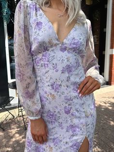 Purple Dress: Needing a gorgeous, summery, floral print dress for a wedding? Our Alyssa Midi Dress is a light purple, floral, midi length dress with a v-neckline, long, sheer sleeves, and a lass up back! She also has a slit up the side for sass! Wedding Guest Accessories, Dress For A Wedding, Purple Floral Dress, Bold Jewelry, Leather Denim, Long Summer Dresses, Midi Length Dress, Sheer Sleeves, Floral Midi Dress