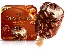 an ice cream with chocolate and almonds on it next to a box of magnetum almond