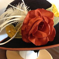 "CARRIAGE DRIVING HELMET HAT/COVER. Helmet not included Nothing in stock ready to ship Each hat is individually made to your specifications. You pick your colors and decorations. Decorations include a handmade ribbon or fabric flower, or silk flower; a feather pin with either a button or jewelry centerpiece; and hatband of netting, ribbon or fabric. Brim has a \"Soft Edge\" - no wire. Wire can be added upon request. *Photos are examples only. Prices start at $125.00 The hats attach to your helme Adjustable Costume Hat For Kentucky Derby, Adjustable Hats For Kentucky Derby Costume, Brimmed Hats For Kentucky Derby Costume, Kentucky Derby Costume Hat With Short Brim, Handmade Adjustable Hats For Races, Carriage Driving, Helmet Hat, Helmet Covers, Fabric Flower