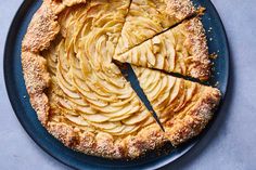 an apple pie with slices cut out on a plate