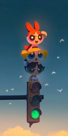 a traffic light with a cartoon character on top of it and birds in the sky