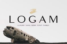 an old airplane sitting on top of a hill with the word logam above it