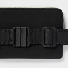 a black belt with two buckles attached to it's side and the other part of