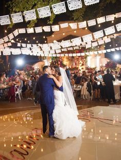 a bride and groom sharing their first dance