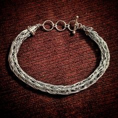 Embark on a journey to the era of fearless Vikings with our enchanting Viking Knit Wire Bracelets! Available in three color options: Silver, Gold, and Copper, these bracelets capture the essence of Viking spirit with their intricate woven texture. Add a touch of magical allure to your style. Channel the strength and bravery of the ancient Norse as you adorn yourself with these unique pieces. Imagine yourself sailing on Viking longships, exploring distant lands, and embracing the adventurous spir Adjustable Fantasy Bracelets As Gift, Silver Braided Bracelets For Festivals, Hand Cast Metal Bohemian Bracelets, Bohemian Hand Cast Metal Bracelets, Handmade Adjustable Chain Bracelet For Festivals, Bohemian Silver Hand Wrapped Braided Bracelets, Handmade Adjustable Medieval Jewelry, Adjustable Handmade Medieval Jewelry, Bohemian Metal Chain Bracelet For Festivals