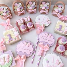 a table topped with lots of pink and white items