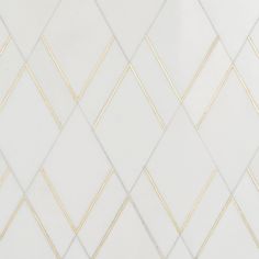 a white and gold tiled wall with lines