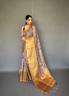 Description:   Embrace tradition with our Pattu Kalamkari saree, featuring a stunning brocade blouse and a contrast pallu adorned with intricate jari weaving.   Experience the luxury of smooth silk, beautifully enhanced by exquisite Kalamkari prints and embossed jari detailing.   The saree boasts a woven border, complemented by a stylish contrast blouse and pallu.   Stunning Kalamkari digital print adds a modern touch to timeless elegance.   Fabrics that speak to your soul   Hurry, book yours today! Luxury Multicolor Kalamkari Print Sets, Festive Tussar Silk Pre-draped Saree With Printed Border, Navratri Meenakari Tussar Silk Pre-draped Saree, Gold Pre-draped Saree With Cutdana In Jamawar, Designer Tussar Silk Pre-draped Saree With Printed Border, Gold Pre-draped Jamawar Saree With Zari Work, Art Silk Saree With Kalamkari Print In Traditional Drape, Art Silk Saree With Kalamkari Print, Traditional Raw Silk Pre-draped Saree With Kalamkari Print