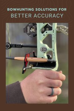 a person holding a bow with the words bowhunting solutions for better acuracy