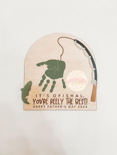 a father's day ornament with a hand holding a fishing rod and the words, it's offishaal you're really the best happy father's day