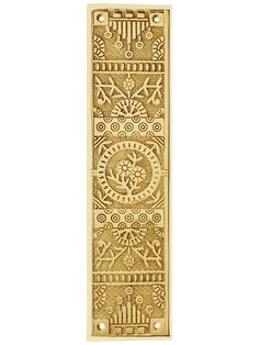 a gold door handle with an intricate design