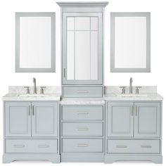 a bathroom vanity with two sinks and mirrors on top of the cabinet, along with an extra mirror