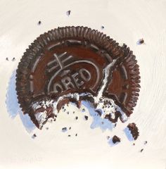 an oreo cookie with the word zero written on it, surrounded by crumbs