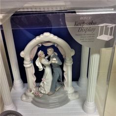 the figurine is in its box on display