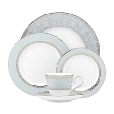 white and silver dinnerware set with saucer