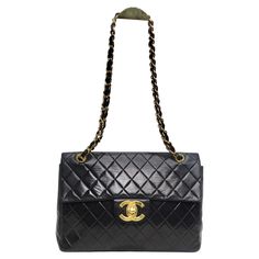 Introducing the Timeless Elegance of Chanel: 1980s Classic Black Leather Maxi Single Flap Handbag! Unveil the epitome of sophistication with our authentic CHANEL Lambskin Quilted Vintage Maxi Single Flap Handbag in Black. This stunning piece hails from the 1980s, encapsulating the enduring allure of Chanel's iconic designs. Crafted with meticulous attention to detail, this bag boasts exquisite black diamond quilted lambskin leather, a hallmark of Chanel's superior craftsmanship. Every stitch and fold is a testament to the brand's dedication to perfection. The Vintage Maxi Single Flap Handbag offers you ample space without compromising on style. Its extra-large dimensions make it perfect for those who value both fashion and functionality. The polished gold-plated chain shoulder straps, eleg Chanel Vintage Bag, Vintage Chanel Bag, Hermes Bracelet, Gucci Heels, Vintage Chanel, Chanel Handbags, Lambskin Leather, Fashion Handbags, Chanel Bag