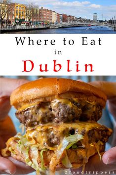 a person holding a hamburger in their hands with the words where to eat in dublin