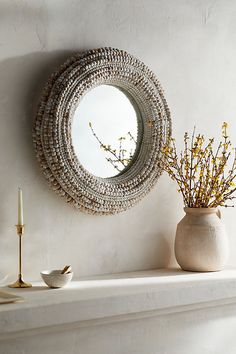 Finished with a ring of natural wood beads, this round mirror makes a natural statement in your home. | Beaded Round Wall Mirror in White at Terrain Beaded Mirror, Decorative Mirrors, Arched Mirror, Vintage Mirrors, Leaf Wall Art, Creative Living, Round Wall Mirror, Hand Poured Candle, Round Mirror