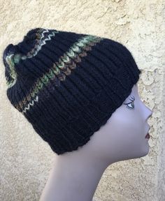 a mannequin head wearing a black knitted hat