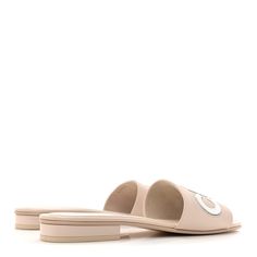 This is an authentic pair of CHANEL Calfskin Patent Calfskin Logo Mules size 39 in Beige. These chic slides are crafted of light beige leather. The slides feature a leather insole and beige leather uppers with a white leather Chanel logo across the top. Chanel Logo, Light Beige, White Leather, Calf Skin, The Top, Slides, Leather Upper, Chanel, ? Logo