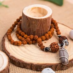 This Rudraksha mala with Narmadeshwar Shivling pendant is perfect for men and women looking to enhance their yoga and meditation practices. The 5 Mukhi Rudraksha beads and Shaligram Narmada pendant offer powerful and beneficial vibrations, providing a deeper connection to the spiritual realm. Elevate your daily wear with this elegant and luxurious accessory. Premium Quality Materials - Crafted with genuine 5 Mukhi Rudraksha beads and a Narmadeshwar Shivling pendant, this mala exudes quality and Sphatik Shivling, Rudraksha Necklace, 5 Mukhi Rudraksha, August Moon, Indian Wall Decor, Narmada River, Rudraksha Mala, Spiritual Realm, Rudraksha Beads