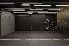 an empty parking garage with two bicycles parked in the space between it and closed doors