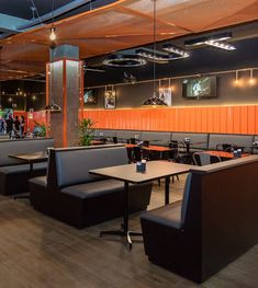 an empty restaurant with tables and chairs