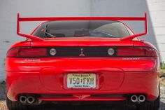 the back end of a red sports car