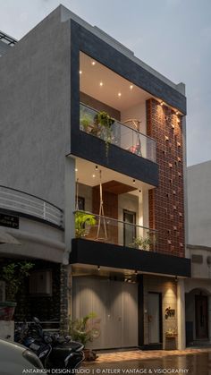 an apartment building with balconies and plants on the balcony