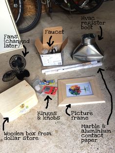 the contents of a bicycle are shown on the floor next to boxes and other items