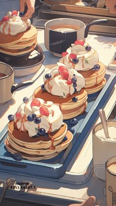 pancakes with berries and whipped cream are on a tray