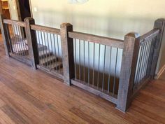 two wooden baby gates sitting on top of a hard wood floor