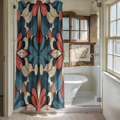 a bathroom with a shower curtain and bathtub