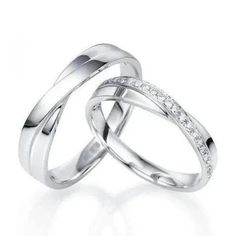 Platinum Couple Rings by Jewelove  Designer Couple Rings with the appearance of 2 bands crossing over. The men's band is plain platinum, the women's band is studded with diamonds on one arm. Metal : Platinum Platinum Purity : 95% Purity Mark : Pt 950 Finishing : Hi-polish Estimated Platinum Weight Men's Band only : 6 grams Women's Band only: 5 grams Diamond Weight : 0.20 cts. Diamond Clarity : VVS or SI (as selected above) Diamond Color : GH or IJ (as selected above) Diamond Grading Report : SGL Platinum Ring For Couple, Anniversary White Gold Double Band, White Gold Double Band For Anniversary, Silver Double Band Diamond Ring For Anniversary, Anniversary Double Band In White Gold, Platinum Diamond Cut Rings For Marriage, Platinum Rings With Diamond Cut For Marriage, Platinum Love Bands Couple Rings, Platinum Rings With Brilliant Cut - Fine Jewelry