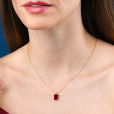 Features * Stylish red necklace with a emerald-cut rectangle pendant on an adjustable 18" chain, including 2-inch extension links. * Gold plated necklace for women with a rectangle red pendant. Simple stone necklaces for women with an 8mm by 10mm Emerald-cut red cubic zirconia stone. * Gold plated solid silver chain and pendant. This elegant gold necklace for women is made from 18K gold plated 925 Sterling Silver. * Cute gold necklaces for women and teenage girls. High-quality 18K gold plated 92 Red Gemstone Square Pendant Necklaces, Red Gemstone Square Pendant Necklace, Red Gemstone Necklace With Square Pendant, Elegant Red Necklace With Rectangular Pendant, Formal Red Square Pendant Necklace, Red Square Cut Jewelry Gift, Red Square Cut Jewelry For Gift, Red Rectangular Stone Jewelry For Gifts, Red Rectangular Stone Jewelry Gift