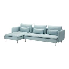 a blue couch with pillows on top of it and one arm folded back to the side