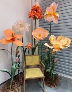 a chair sitting in front of some flowers